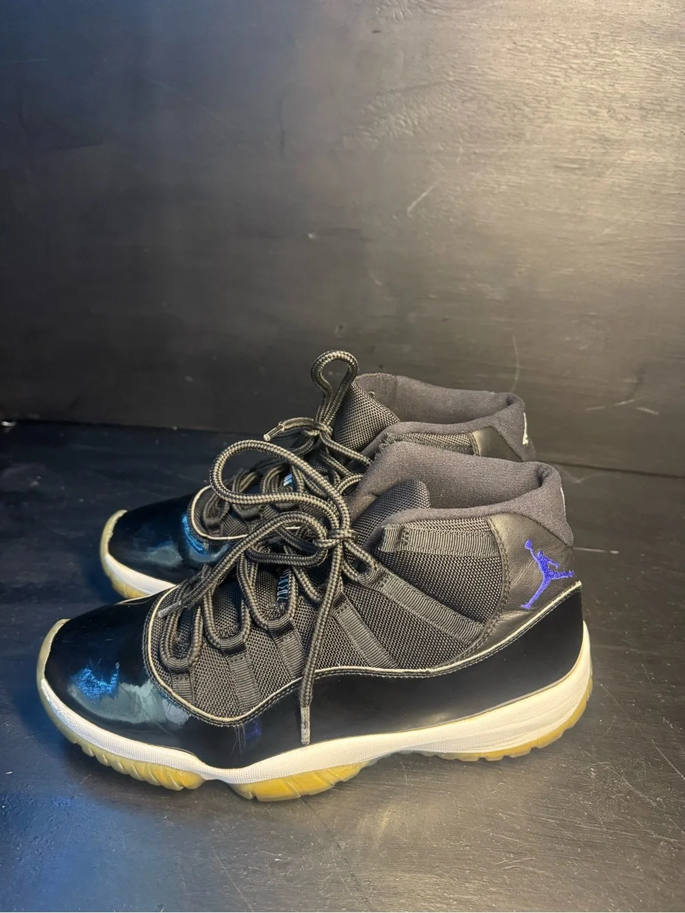 Jordan 11 Men’s Black Sneakers with Blue Jumpman